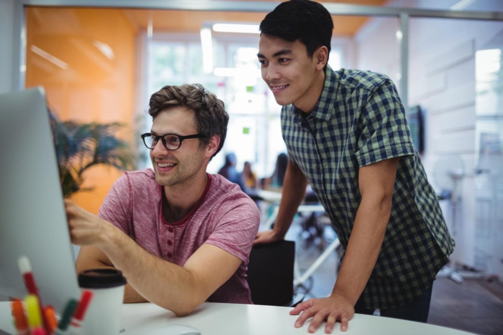 Developer reviewing mobile app testing results and debugging code